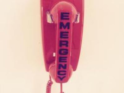 Red indoor phone marked EMERGENCY